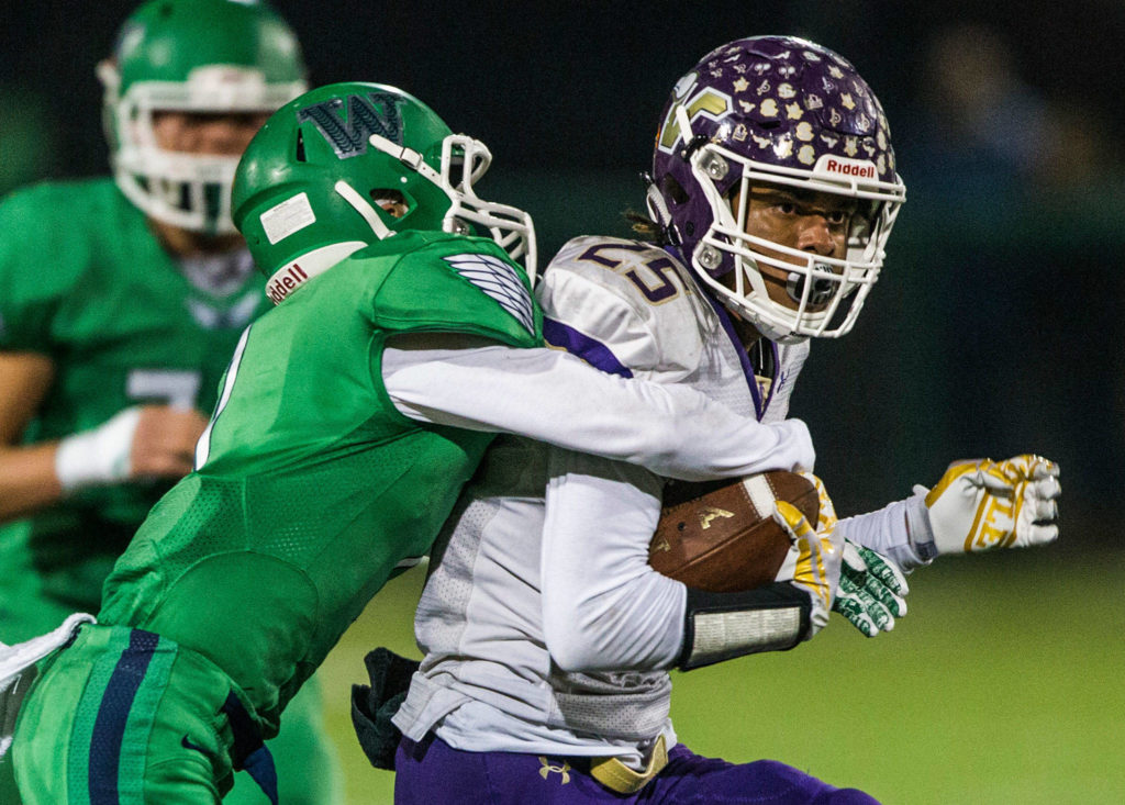 Lake Stevens&rsquo; Kasen Kinchen is tackled during the Class 4A state state semifinal game against Woodinville at Pop Keeney Stadium on Saturday, Nov. 24, 2018 in Bothell, Wa. (Olivia Vanni / The Herald)
