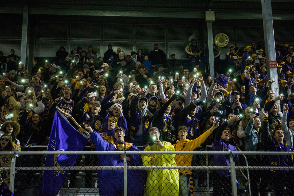 The Lake Stevens student sections sings &ldquo;Na Na Hey Hey&rdquo; to the Woodinville stands during the Class 4A state state semifinal game against Woodinville at Pop Keeney Stadium on Saturday, Nov. 24, 2018 in Bothell, Wa. (Olivia Vanni / The Herald)
