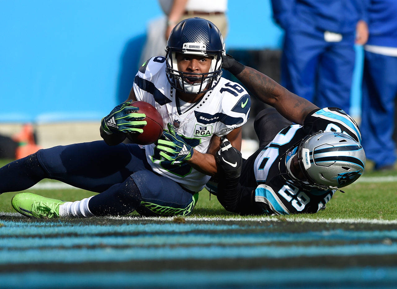 Seattle wide receiver Tyler Lockett (16) scores a touchdown against Carolina’s Mike Adams (29) during the second half of Sunday’s game in Charlotte, North Carolina. (AP Photo/Mike McCarn)