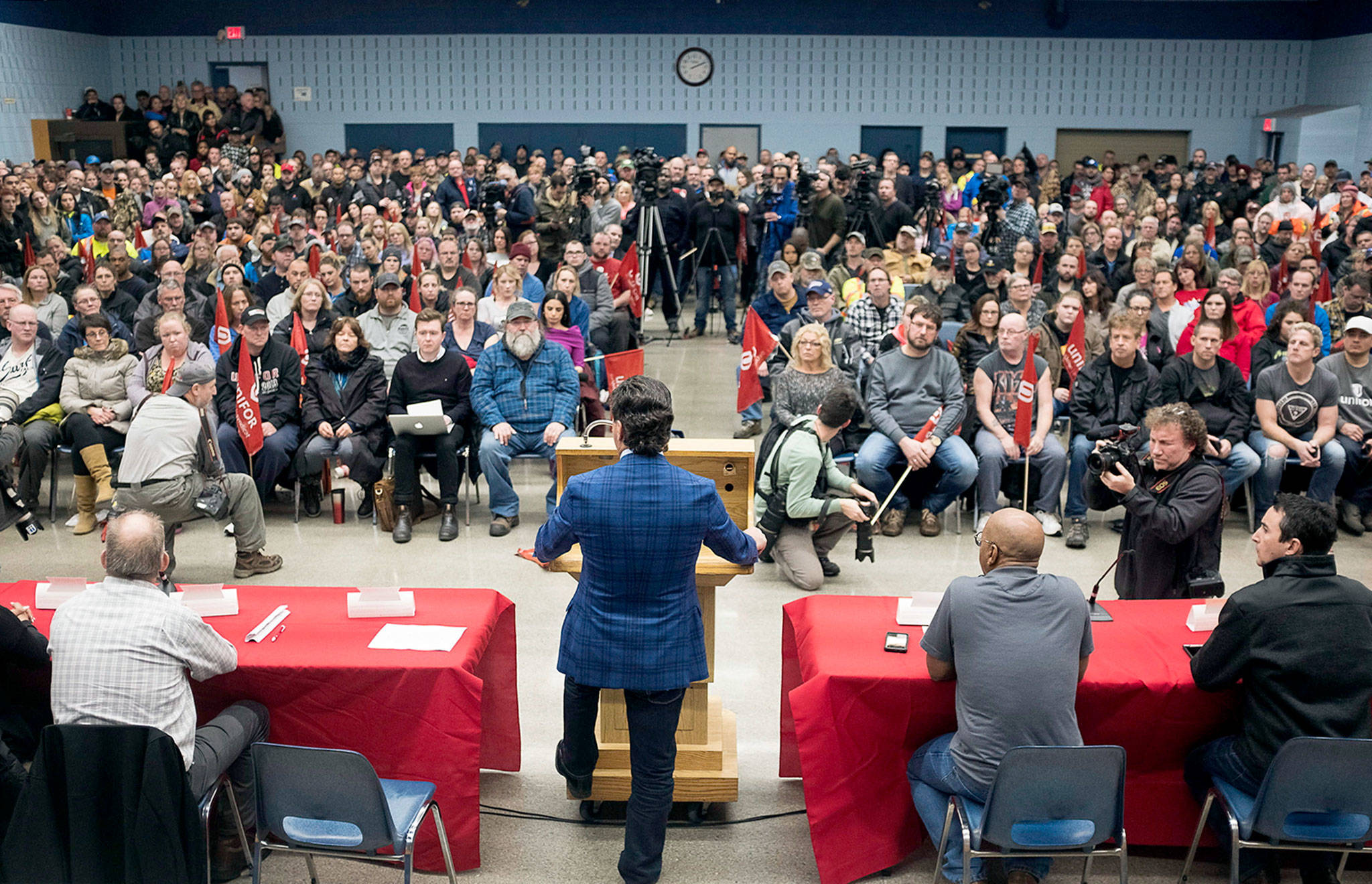 Jerry Dias, president of UNIFOR, a union at the Oshawa, Ontario, General Motors assembly plant, speaks to workers at the union headquarters Monday. (Eduardo Lima/The Canadian Press via AP)