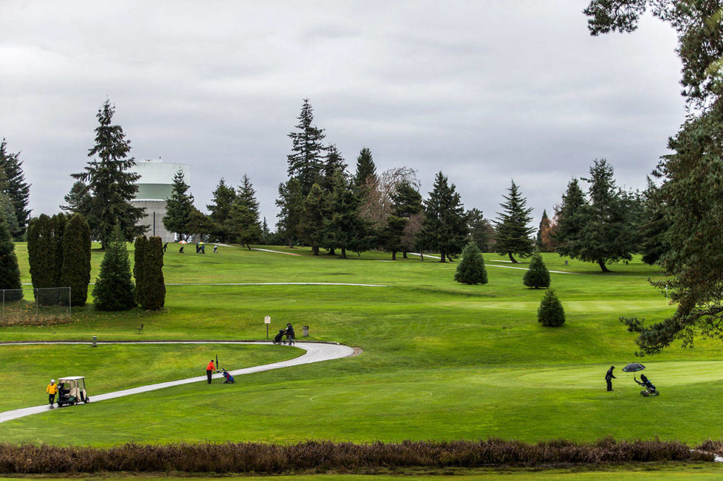 Golfers at Walter E. Hall Golf Course on Wednesday in Everett. (Olivia Vanni / The Herald) 
