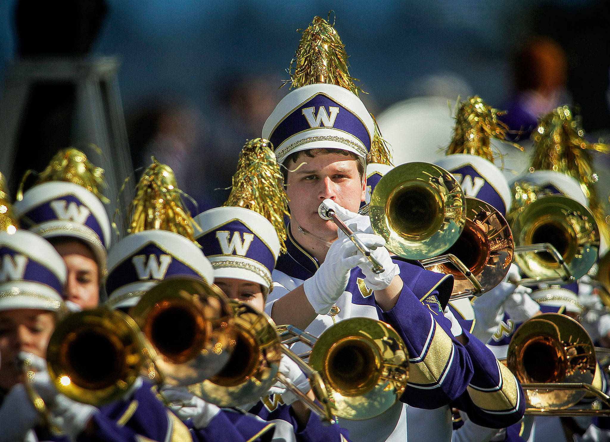 Trombone player Patrick Stanton with the Husky Marching Band in 2015. Now a UW senior, the Lake Stevens High School graduate and his sister, Elizabeth Stanton, will play with the band in Santa Clara, California, Friday. (Ian Terry / Herald File)
