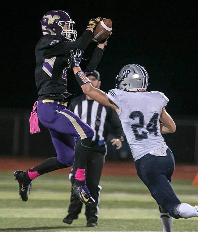 Lake Stevens’ Devin MacWatters intercepts a pass intended for Glacier Peak’s Evan Mannes during a game on Oct. 5, 2018, at Lake Stevens High School. (Kevin Clark / The Herald)