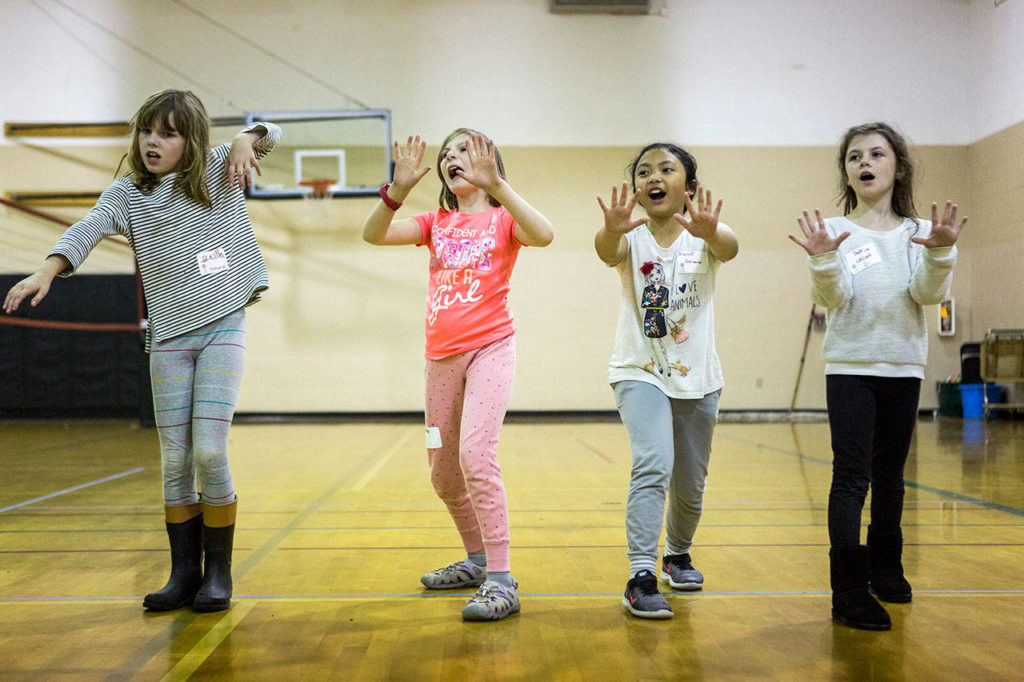 From left, 9-year-olds Stella McClung, Hailey Gaddis, Irajoy Abrea and Sabrina Axtell play Sensei Says during an InspireHER event at the Snohomish Boys & Girls Club. (Olivia Vanni / The Herald) 
