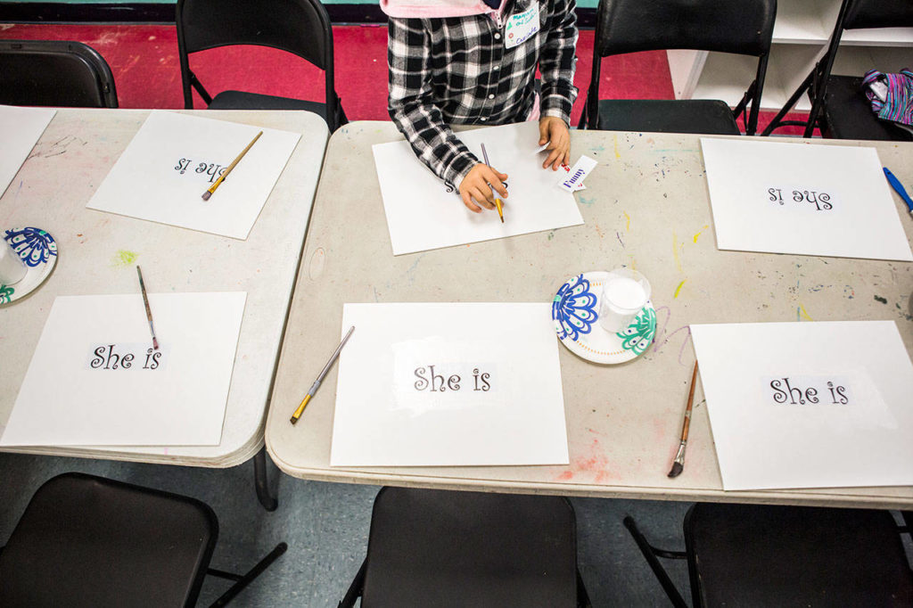 Maryam Al Safar, 8, works at an InspireHER event at the Snohomish Boys & Girls Club. (Olivia Vanni / The Herald)
