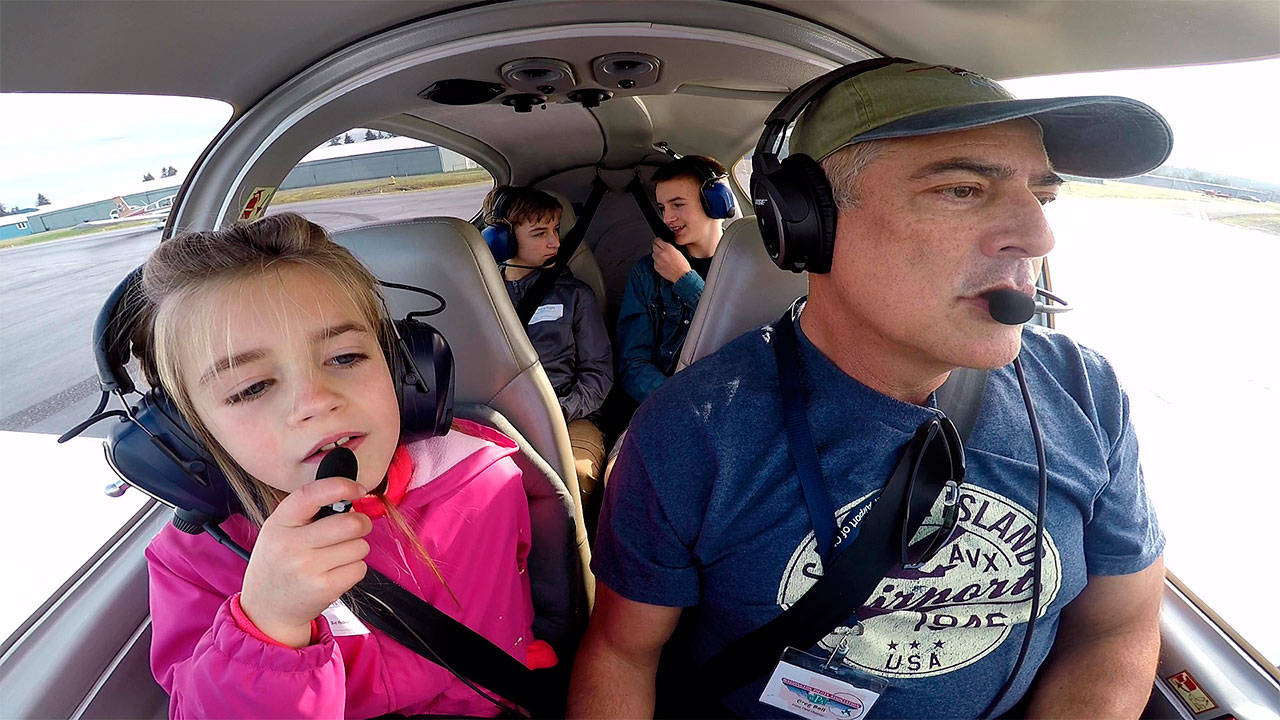 Contributed photo                                 Greg Bell gets ready to take off to give Emily McKinley, 8, and two other young passengers a taste of general aviation as part of the Experimental Aircraft Association’s Young Eagles program.