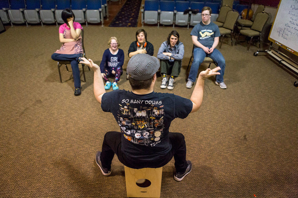 Scott Grossman, 20, finishes a solo performance during the Music YoU-ROCK program at the Northwest Music Hall in Everett. (Olivia Vanni / The Herald) 
