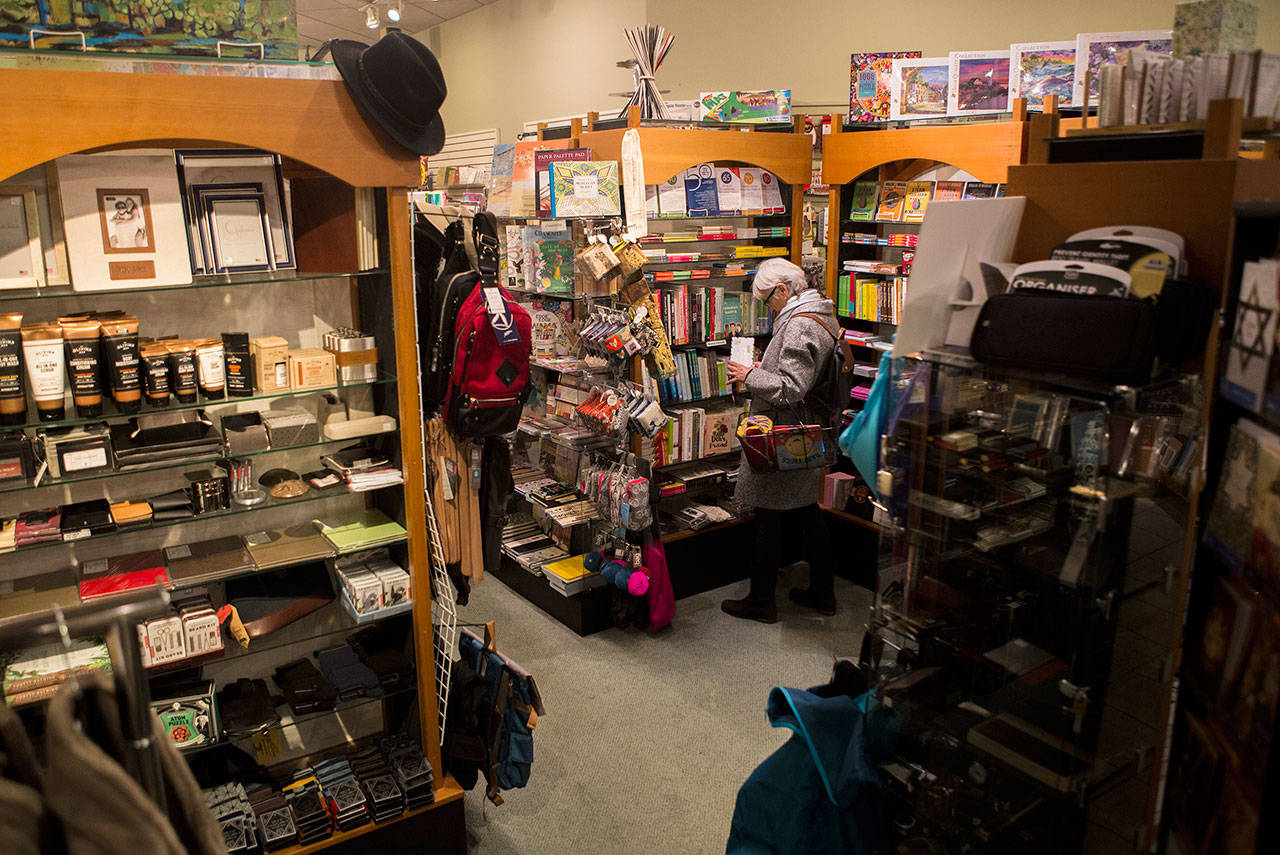 People shop at J. Matheson Gifts, Kitchen Gourmet in Everett. (Olivia Vanni / The Herald)