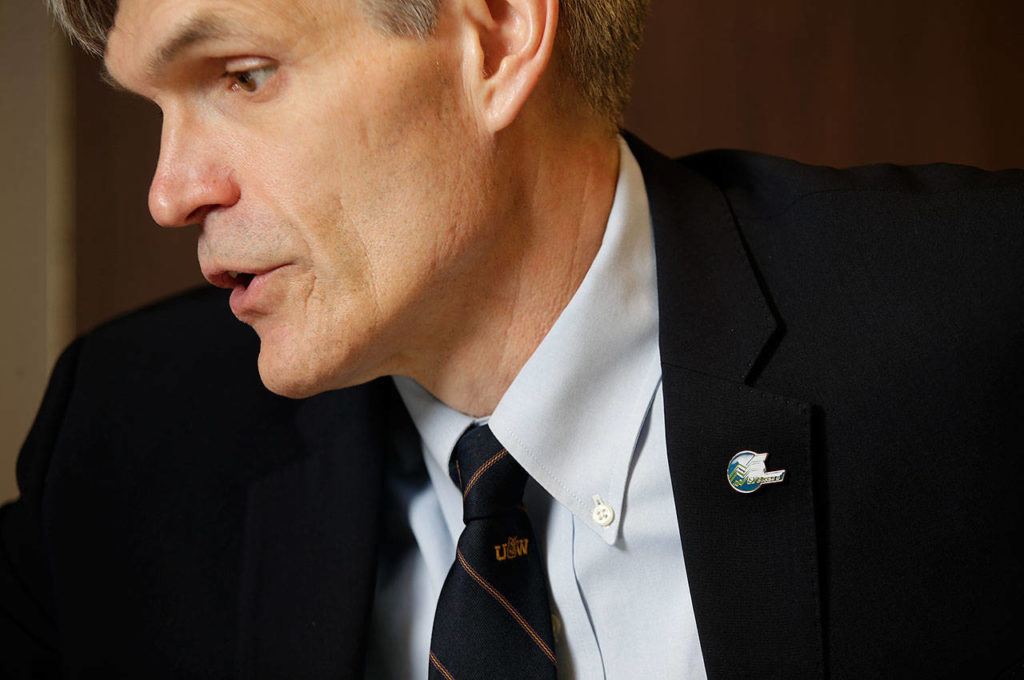 Everett’s new Director of Economic Development Dan Eernissee sports a University of Washington tie, harkening back to his time as a center on the Husky football team, on Nov. 21 in Everett. (Andy Bronson / The Herald)
