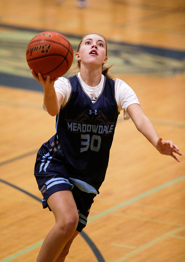 Camryn Cassidy takes part in a girls basketball practice Nov. 19 at Meadowdale High School in Lynnwood. (Andy Bronson / The Herald)