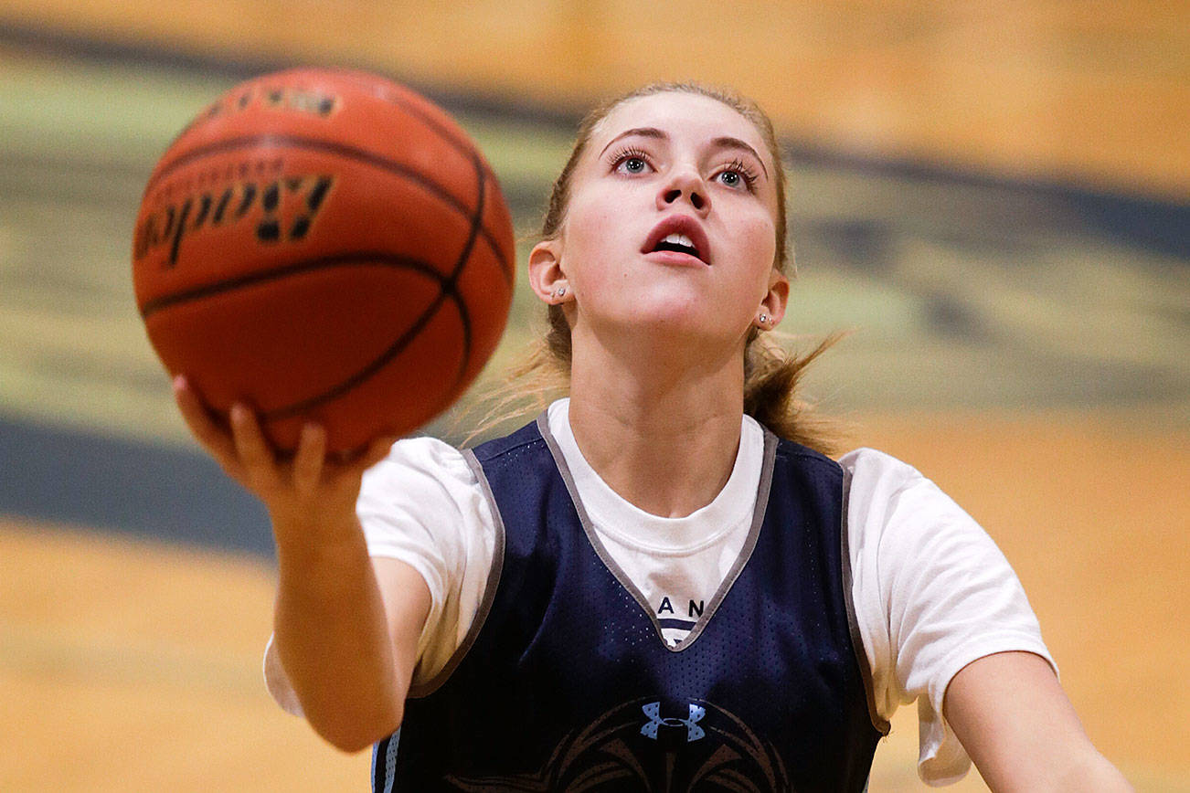 Meadowdale High’s Camryn Cassidy practices layups on Monday, Nov. 19, 2018 in Lynnwood, Wa. (Andy Bronson / The Herald)