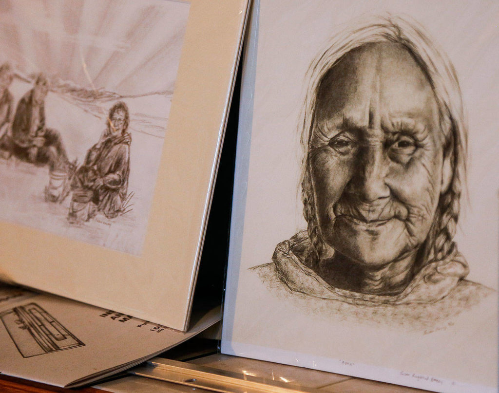 Susan Ringstad Emery drew this portrait of her great-grandmother (right). Her name was Annie Koonuk. Emery is a descendant of Inupiaq and Scandinavian people, and uses the imagery from her ancestry in her art. (Dan Bates / The Herald)
