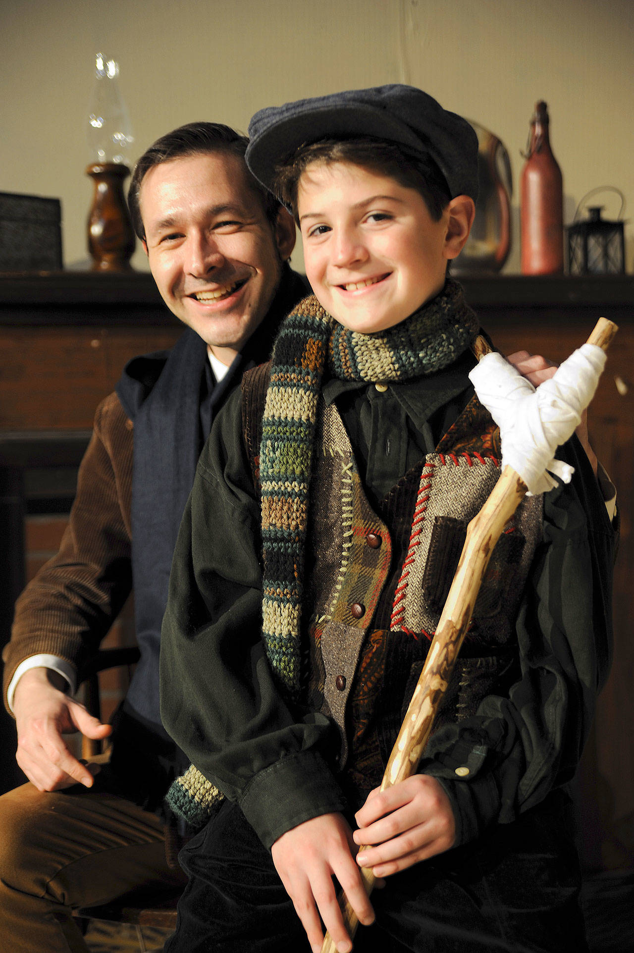 Ben St. Hilaire (Bob Cratchit) and Pierce Parsons (Tiny Tim) star in Red Curtain’s production of “A Christmas Carol.” (Larry T. Lisk)
