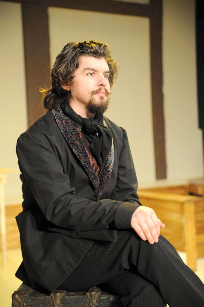 Marysville’s David Henry plays both Charles Dickens and Ebenezer Scrooge in Red Curtain’s production of “A Christmas Carol,” staging through Dec. 16 at the Red Curtain Arts Center in Marysville. (Larry T. Lisk)
