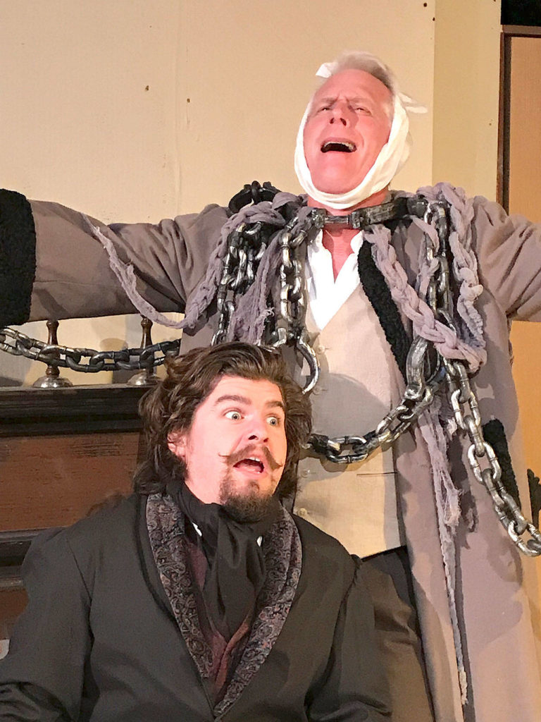 The ghost of Jacob Marley (Christopher Bartness) pays a visit to Ebenezer Scrooge (David Henry). (Larry T. Lisk)
