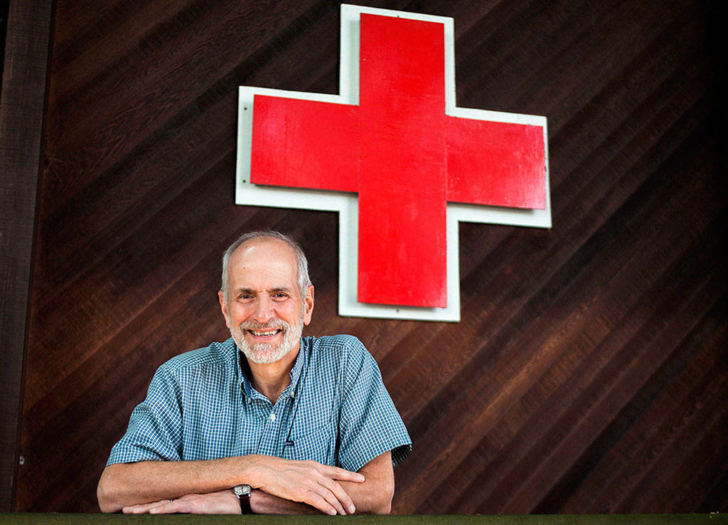 Chuck Morrison outside of the Snohomish Country Red Cross building on July 2 in Everett. Morrison retired after working for the Red Cross for more than 14 years. He is the 2018 recipient of the Red Cross’ Clare Waite Humanitarian Award. (Olivia Vanni / Herald file)
