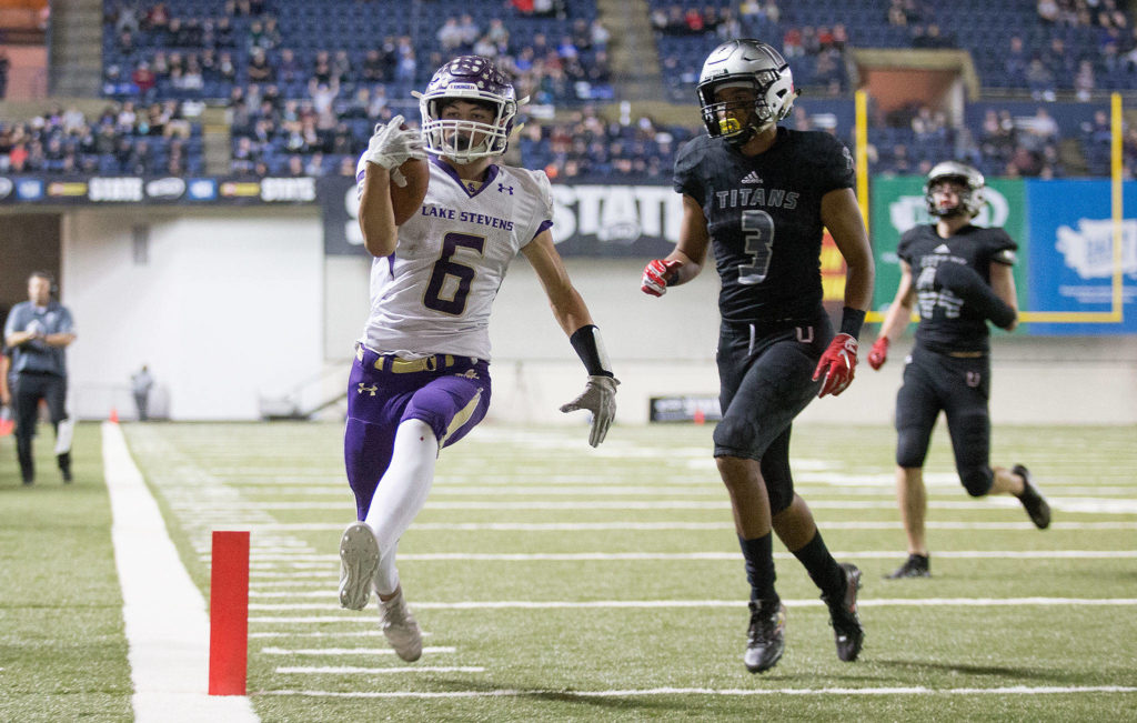Lake Stevens’ Dallas Landeros scores a touchdown in the first quarter of Saturday’s game in Tacoma. (Andy Bronson / The Herald)
