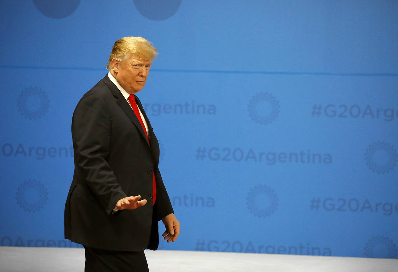 United States President Donald Trump arrives for the G20 Leader’s Summit group photo inside the Costa Salguero Center in Buenos Aires, Argentina, on Nov. 30. (Andres Martinez Casares/Pool via AP)