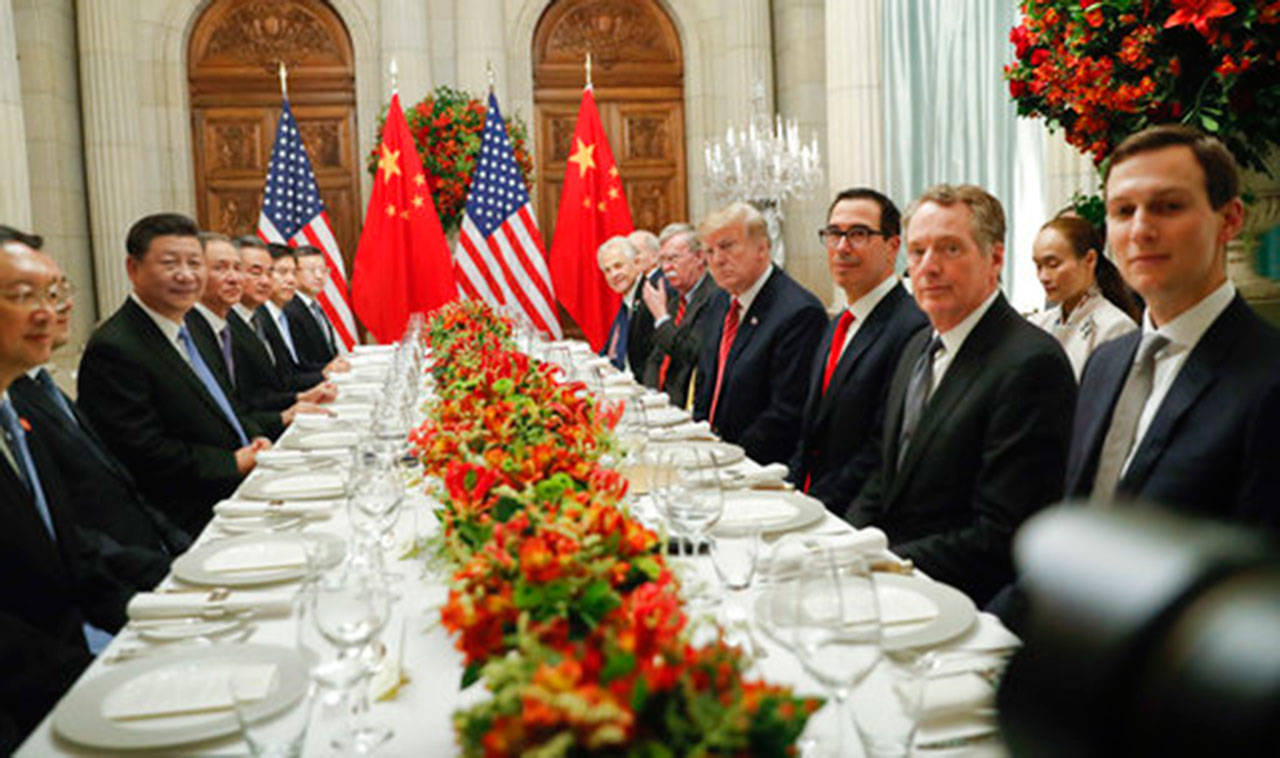 President Donald Trump with China’s President Xi Jinping and members of their official delegations Saturday, Dec. 1, during their bilateral meeting at the G20 Summit in Buenos Aires, Argentina. (AP Photo/Pablo Martinez Monsivais)