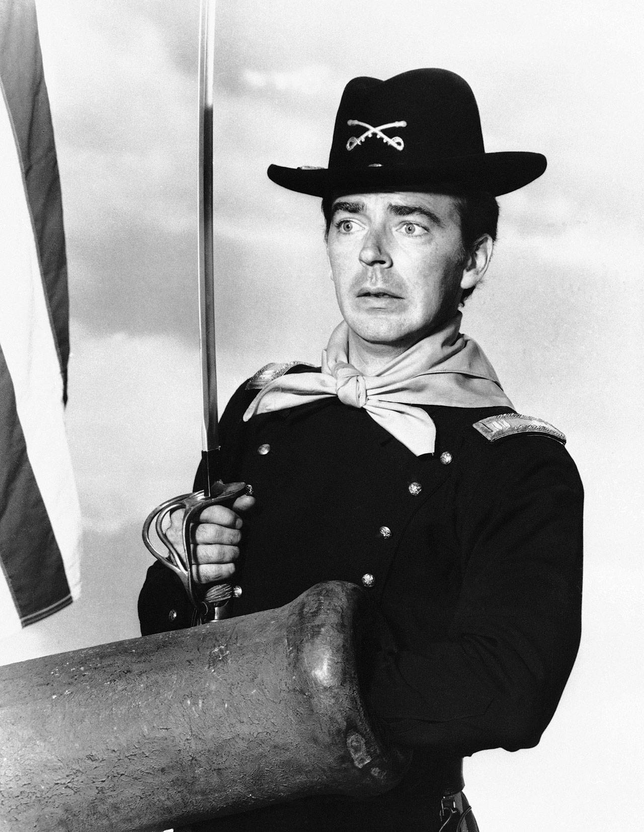 Ken Berry, who played Captain Wilton Parmenter in a TV series called “F Troop,” reaches down the wrong end of cannon in one of the show’s episodes in this July 1, 1965, photo. A spokeswoman at Providence St. Joseph in Burbank, California, confirmed Berry died Saturday. He was 85. (AP Photo, File)