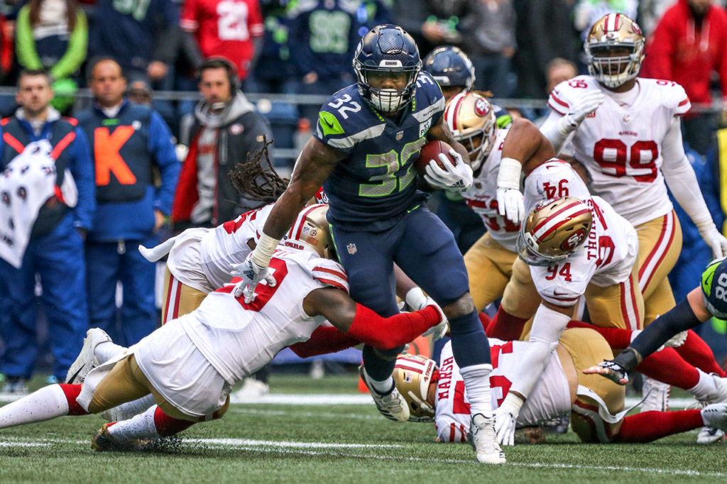 Seahawks running back Chris Carson rushes for yardage against the 49ers Sunday afternoon at CenturyLink Field in Seattle on December 2, 2018. Seahawks won 46-16. (Kevin Clark / The Herald)
