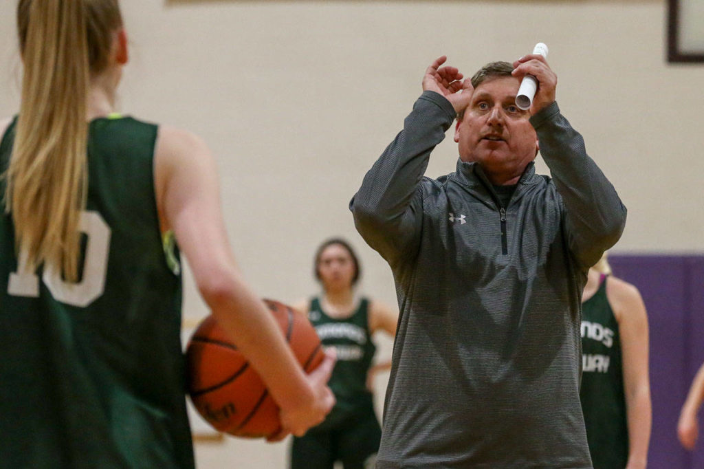 Edmonds-Woodway girls basketball coach Jon Rasmussen gives instruction during a Nov. 28 practice session in Edmonds. (Kevin Clark / The Herald)
