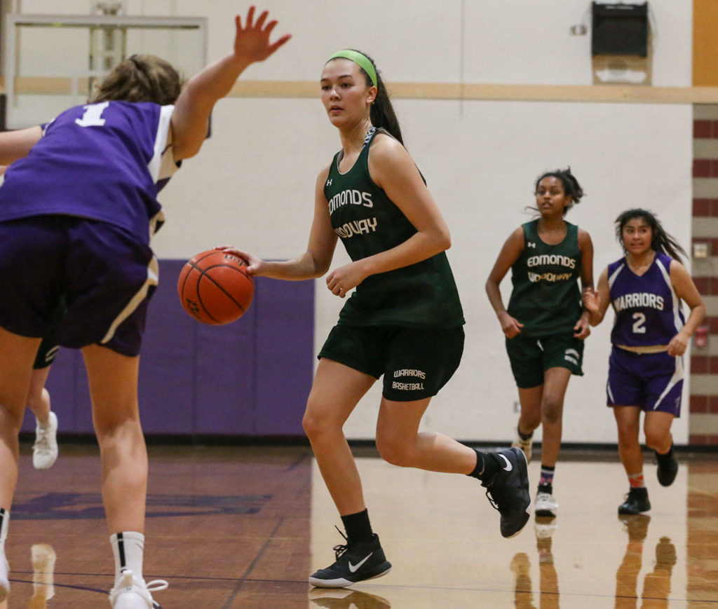 Edmonds-Woodway’s Rebekah Dasalla-Good brings the ball upcourt during practice Nov. 28 at Edmonds-Woodway High School. (Kevin Clark / The Herald)
