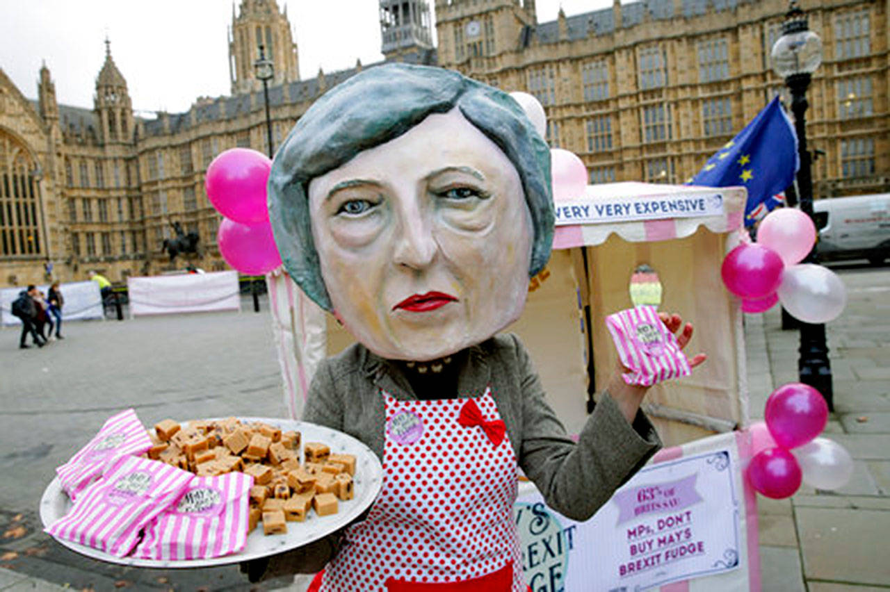 A person dressed as British Prime Minister Theresa May at a “Brexit Fudge” pop-up shop organized by pro-Europe activists outside the Houses of Parliament in London on Monday. (AP Photo/Tim Ireland)