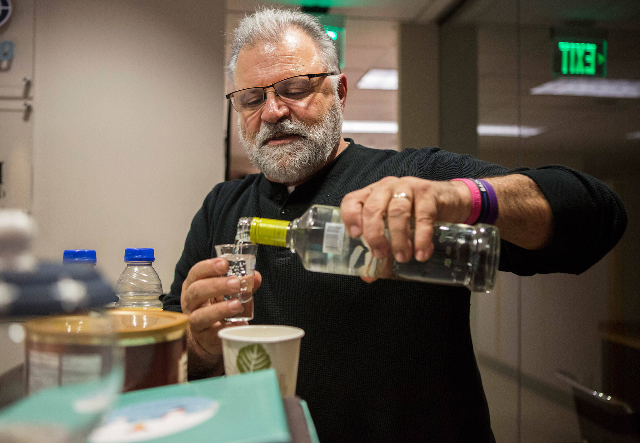Radio host Maury Eskenazi makes his fourth drink during the annual “DUI Awareness Show” at the KRKO 1380 AM office in Everett. (Olivia Vanni / The Herald)