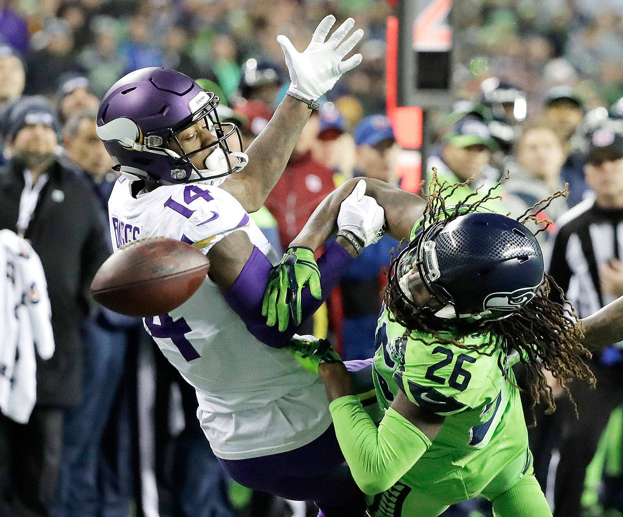 Seattle Seahawks cornerback Shaquill Griffin (26) breaks up a pass intended for Minnesota Vikings wide receiver Stefon Diggs (14) in the second half of an NFL football game, Monday, Dec. 10, 2018, in Seattle. The Seahawks won 21-7. (AP Photo/Ted S. Warren)