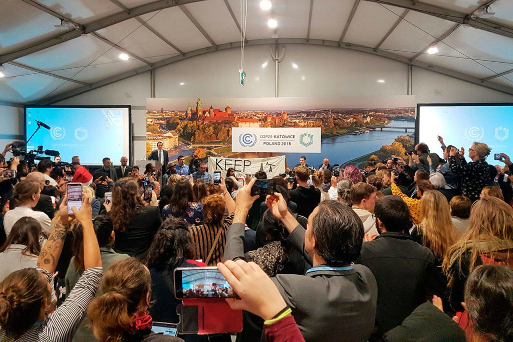 Youth and indigenous groups protest against fossil fuels during U.S.-hosted event Monday at the U.N. climate talks in Katowice, Poland. (AP Photo/Frank Jordans)
