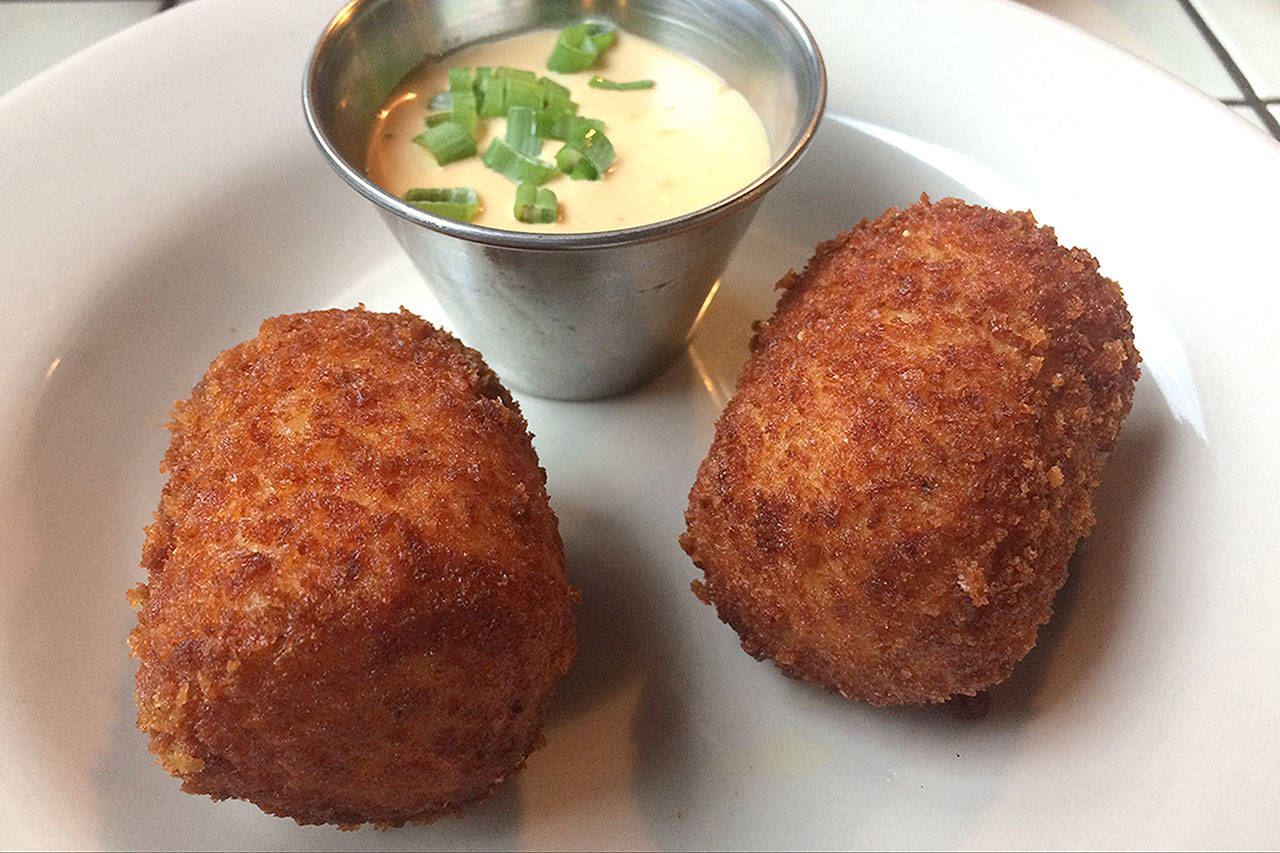 The giant tater tots at Diamond Knot Brewery & Alehouse in Mukilteo come stuffed with cheddar cheese and bacon. Dip them in Diamond Knot’s signature pub sauce. (Evan Thompson / The Herald)