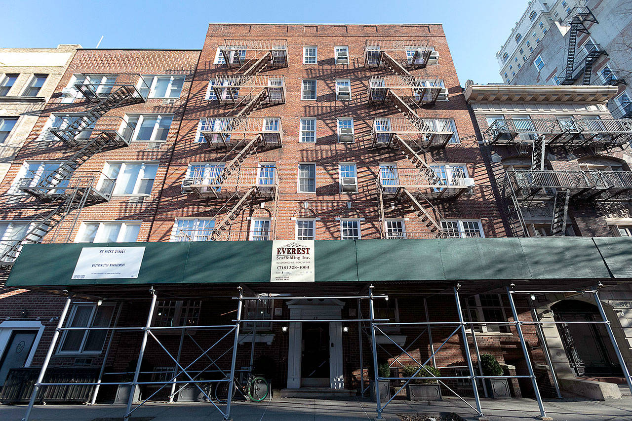 An apartment building owned by Kushner Companies in the Brooklyn Heights neighborhood of New York. An Associated Press investigation found that President Donald Trump’s daughter and son-in law could benefit from a program they pushed that offers massive tax breaks to developers who invest in downtrodden American areas. (AP Photo/Mark Lennihan)