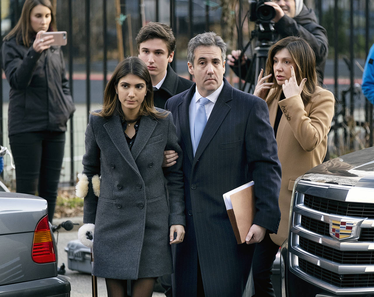 Michael Cohen (right), President Donald Trump’s former lawyer, arrives at federal court with his daughter Samantha Cohen (center) and sonJake Cohen on Wednesday. (AP Photo/Julio Cortez)