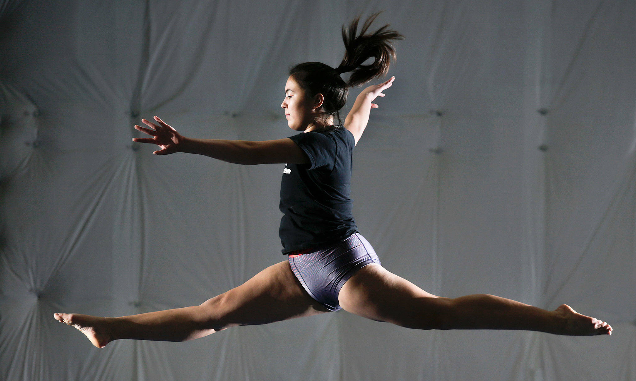 Shorecrest senior Victoria &quot;Tory&quot; Collins performs a split leap on the beam during practice at Cascade Elite Gymnastics on Wednesday, Dec. 19, 2018 in Everett, Wa. Collins spent 10 years as a club gymnast, and after leaving the club team and temporarily quitting gymnastics, she’s thriving as a member of the Scots. She’s an all-around gymnast, but the beam is her best event. (Andy Bronson / The Herald)