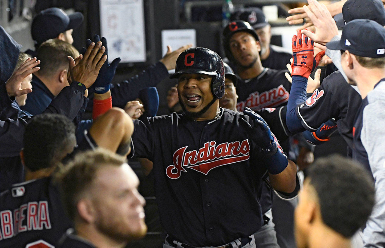 In this Sept. 26, 2018, photo, Edwin Encarnacion of the Cleveland Indians celebrates in the dugout after hitting a three-run home run against the Chicago White Sox. (AP Photo/Matt Marton, File)