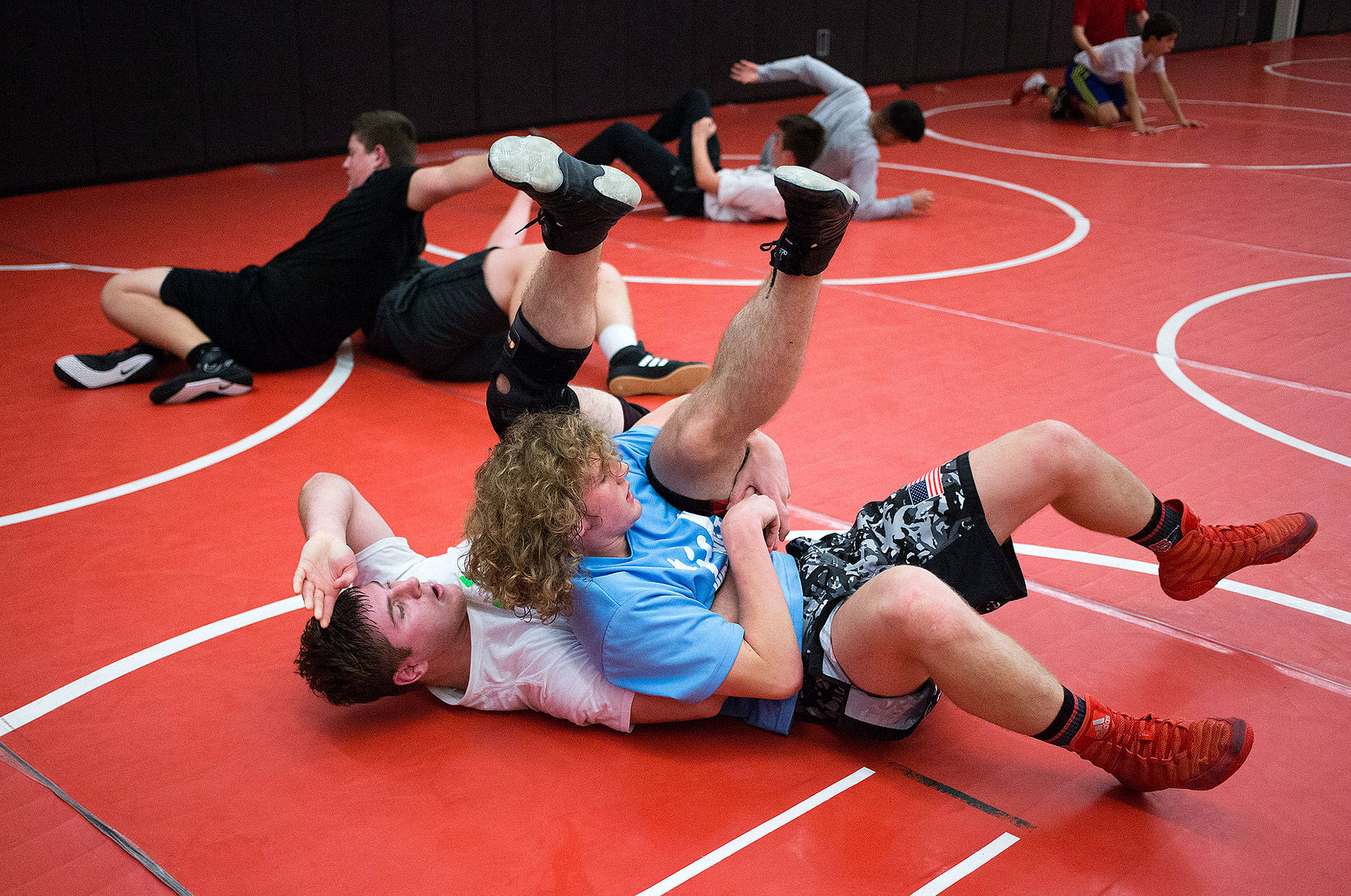 Snohomish’s Dylan Wheeler (right) and Matt Currier wrestle during the Panthers’ Dec. 11 practice in Snohomish. (Andy Bronson / The Herald)