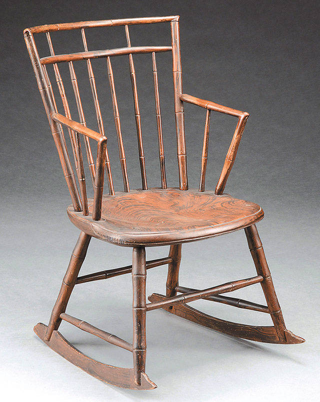 There was an old note found taped to the bottom of this birdcage rocker when it was put up for sale at a James Julia auction. It traced the chair back to a Massachusetts woman who was hung as a witch. (Cowles Syndicate Inc.)