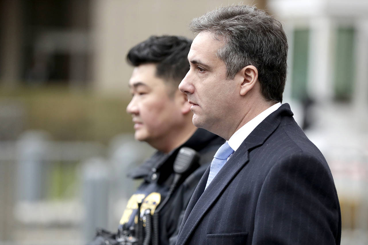 Michael Cohen, President Donald Trump’s former lawyer, leaves federal court after his sentencing in New York on Wednesday. (AP Photo/Julio Cortez)