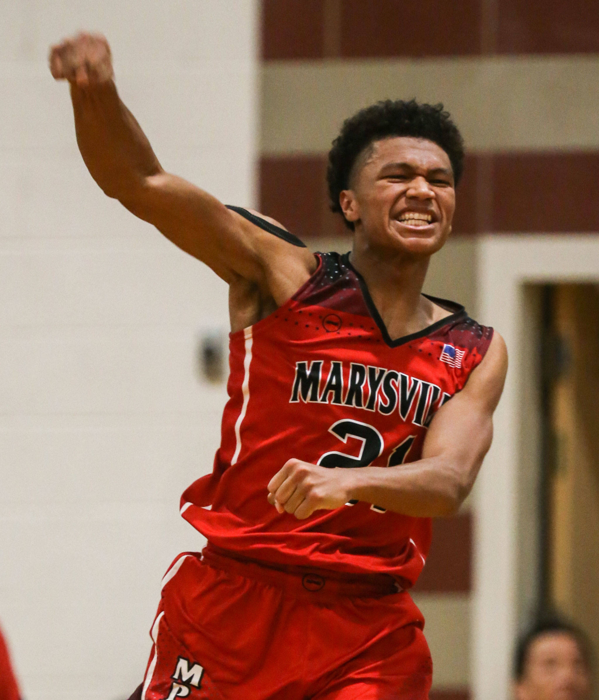 Marysville Pilchuck’s RaeQuan Battle celebrates his game-winning basket after the Tomahawks beat Edmonds-Woodway 55-53 Friday in Edmonds. (Kevin Clark / The Herald)
