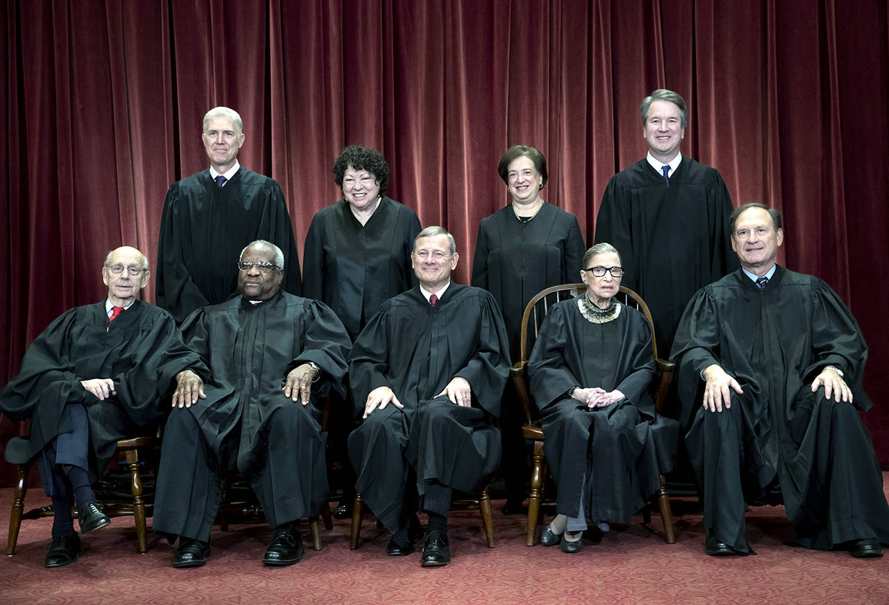 The justices of the U.S. Supreme Court gather Nov. 30 for a formal group portrait. Front row, seated from left: Associate Justice Stephen Breyer, Associate Justice Clarence Thomas, Chief Justice of the United States John G. Roberts, Associate Justice Ruth Bader Ginsburg and Associate Justice Samuel Alito Jr. Back row, from left: Associate Justice Neil Gorsuch, Associate Justice Sonia Sotomayor, Associate Justice Elena Kagan and Associate Justice Brett M. Kavanaugh. (AP Photo/J. Scott Applewhite, file)