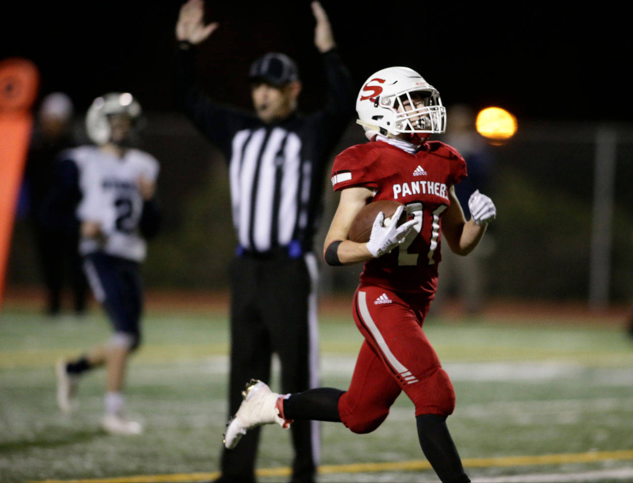 Snohomish’s Tyler Massena runs in for a touchdown during a game against Squalicum on Oct. 26, 2018, at Veterans Memorial Stadium in Snohomish. (Andy Bronson / The Herald)