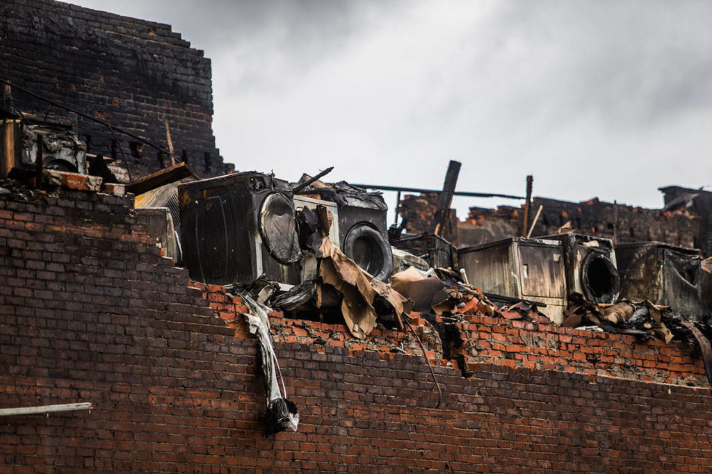 Olivia Vanni / Herald file
Washing machines and dryers melted in the heat of the Judd & Black fire in Everett on Sept. 22.
