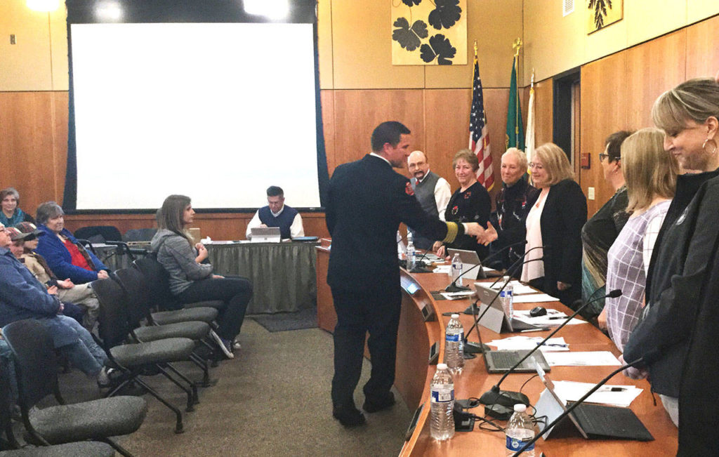 The new fire chief thanks the town council. (Arlington Times)
