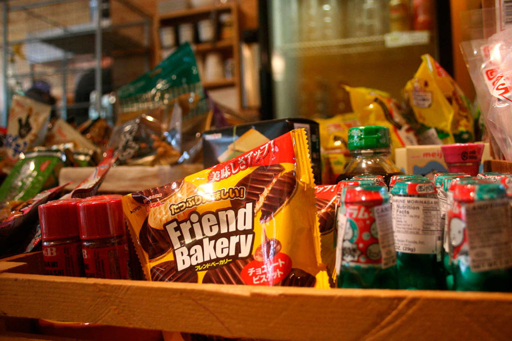 Denis Zimmermann sells snacks and beverages he used to eat as a kid growing up in Japan at Ultra House. (Emily Gilbert / Whidbey News-Times)
