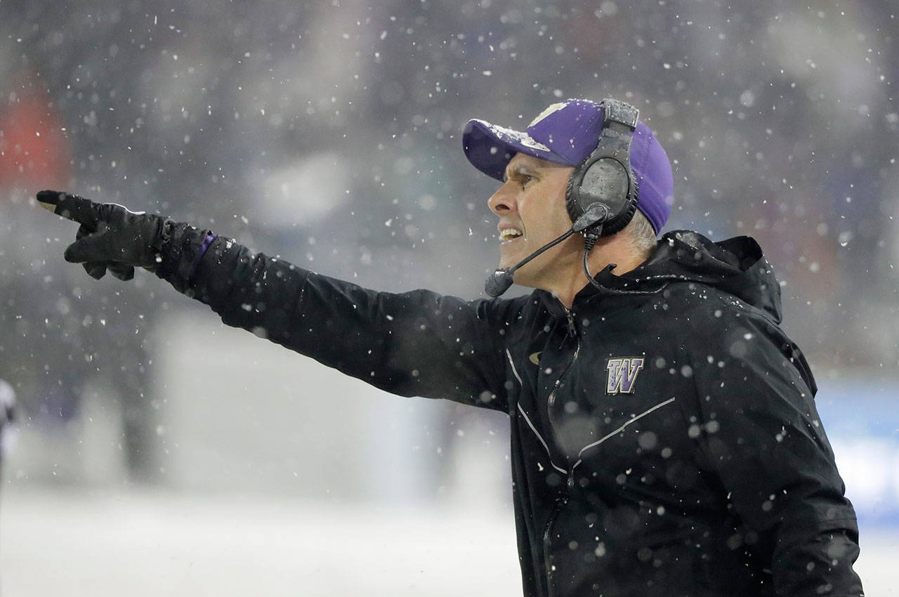 Washington head coach Chris Petersen gestures from the sideline during the second half of the Apple Cup against Washington State on Nov. 23, 2018, in Pullman. (AP Photo/Ted S. Warren)