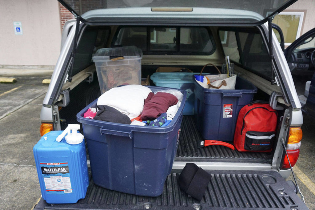 VashonBePrepared President Vicky de Monterey Richoux keeps several bins with supplies in the back of her car. (Melissa Hellmann / Seattle Weekly)
