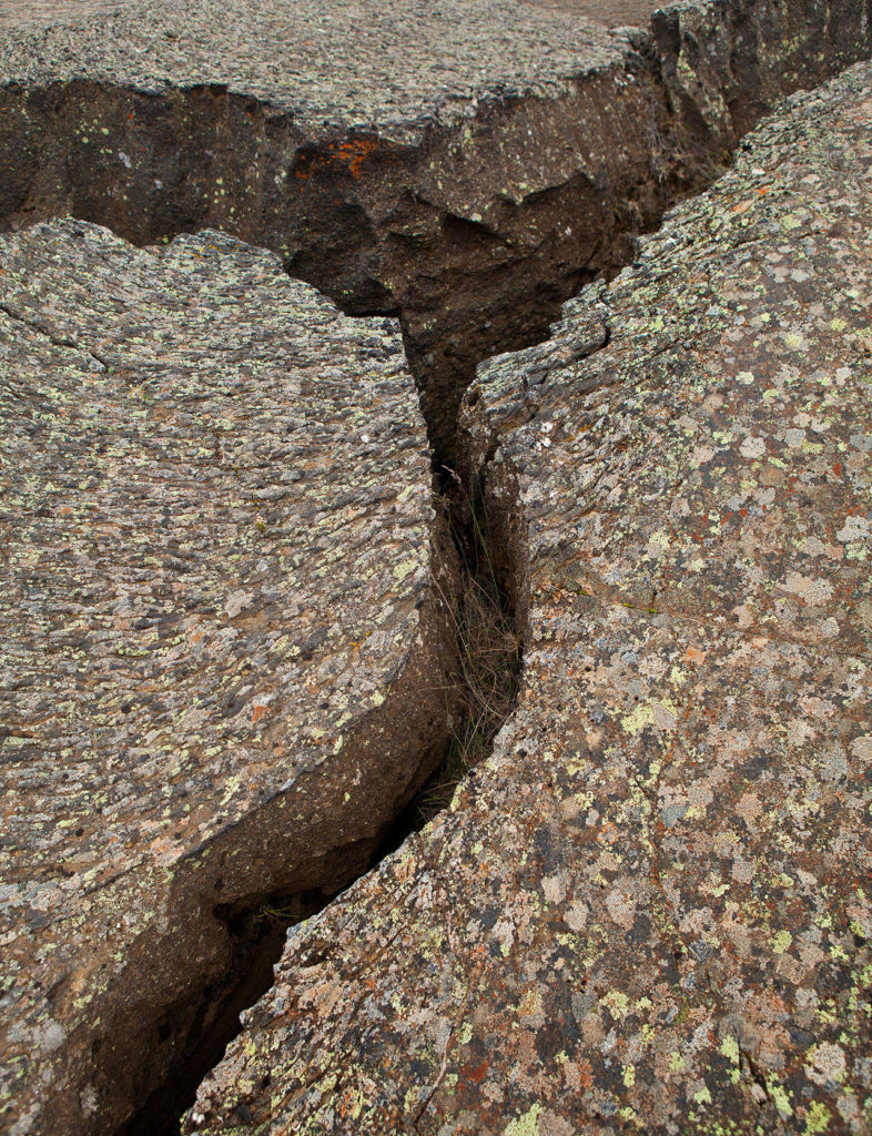 Earthquake cracks in lava, lichen on top. (Herald file)
