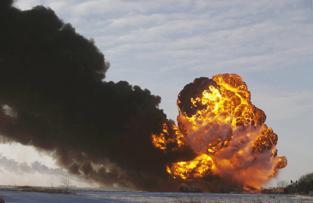 In this 2013 photo, a fireball goes up at the site of an oil train derailment near Casselton, North Dakota. (AP Photo/Bruce Crummy, File)
