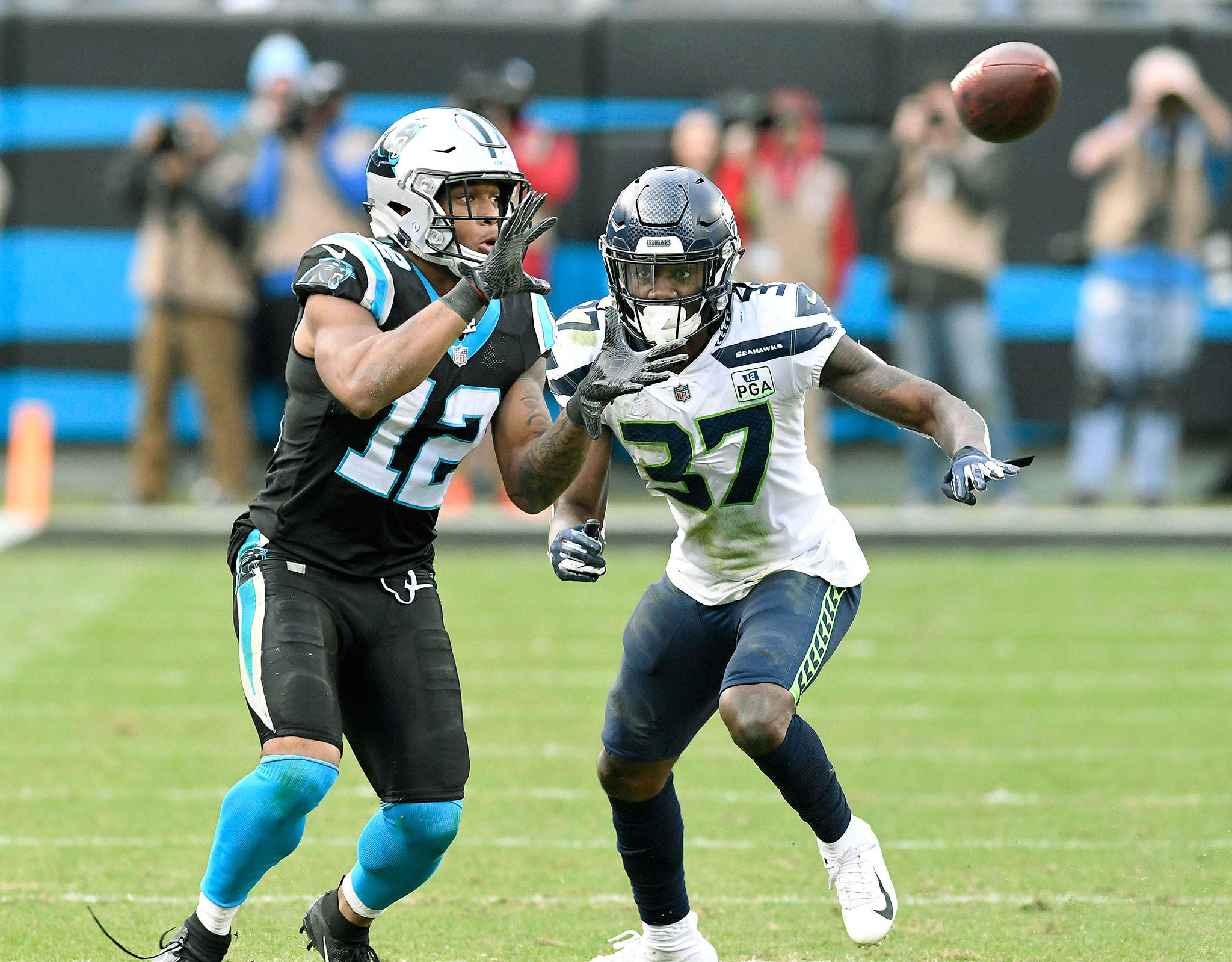 Carolina’s DJ Moore makes a reception in front of Seattle’s cornerback Tre Flowers in the second half of a Nov. 25 game in Charlotte, N.C. (David T. Foster III/Charlotte Observer/TNS)